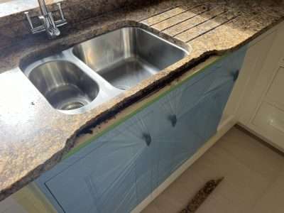 Granite Sink Large Crack Repair Scaled | Large loose piece needed to be removed, revealing the steel support