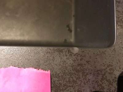 Neolith Iron Grey Chip Repairs | A chip near the sink edge 